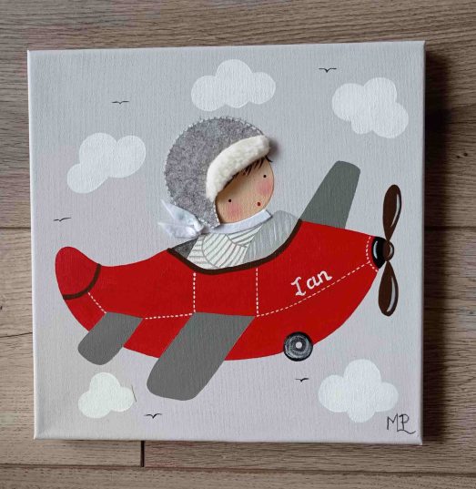 Cuadro infantil personalizado con nombre: Avión volando en un cielo azul